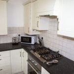 kitchen with gas hob and electric oven